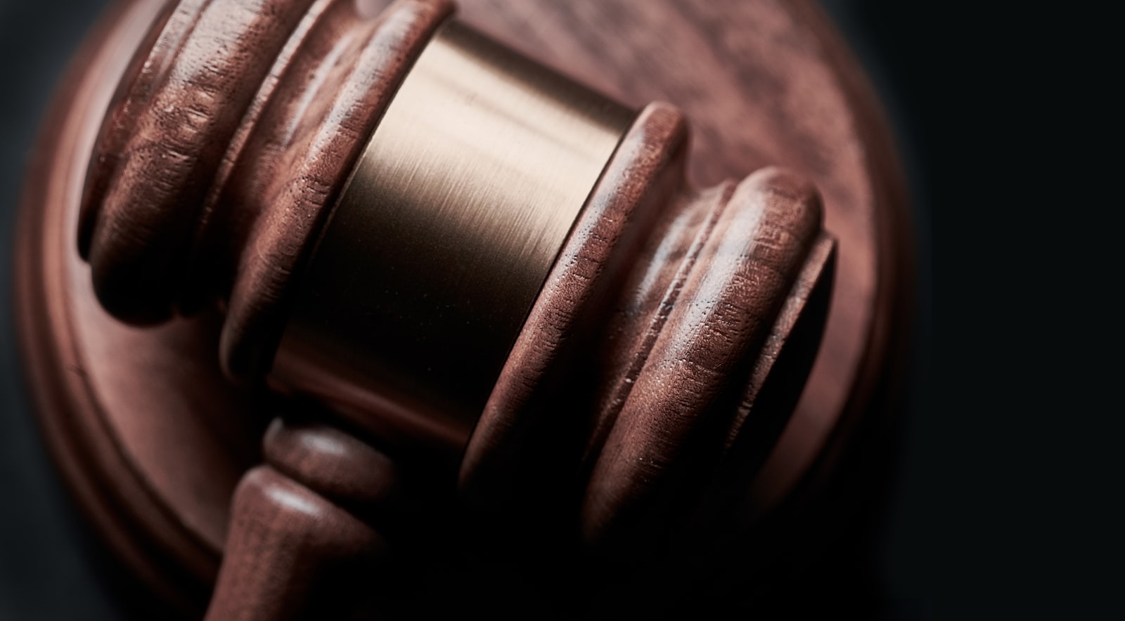 Wooden judge's gavel on a sound block