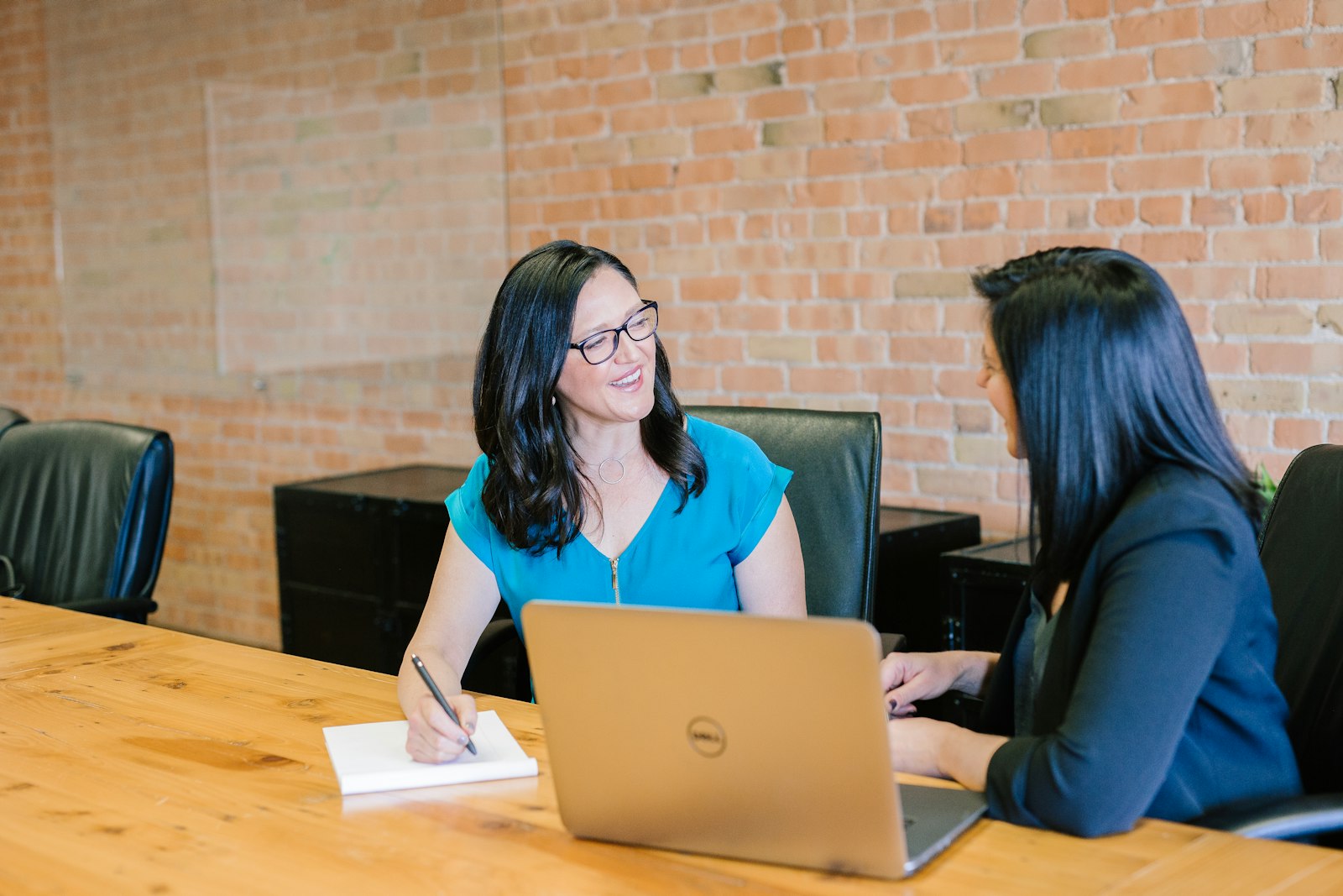 Legal adviser presenting documents to clients during a consultation